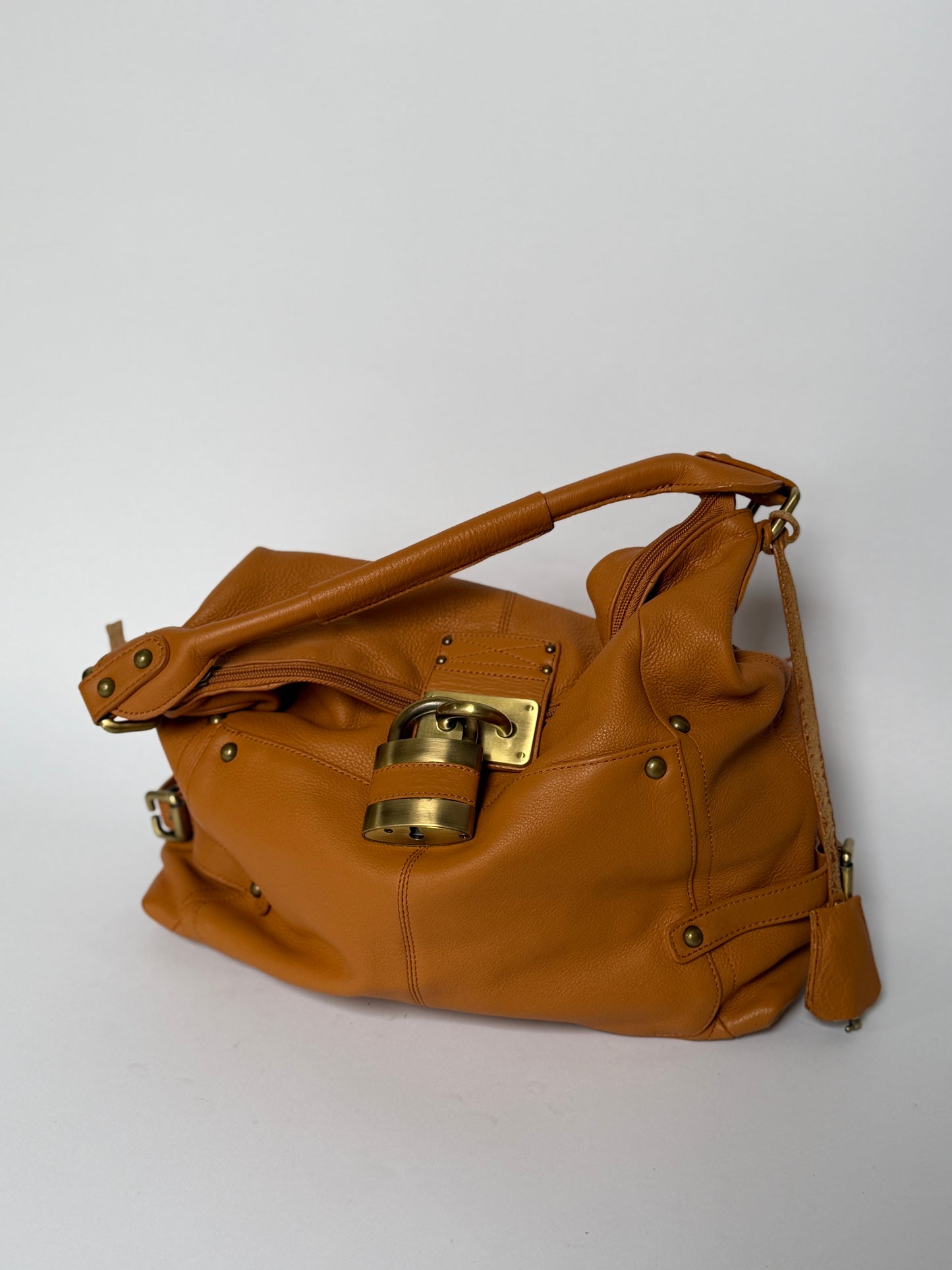Peaks Peak Tan Textured Leather Shoulder Bag — Padlock Detail